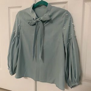 Blue long sleeve business casual top